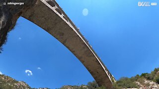 Youngster pulls off jaw-dropping dive from bridge