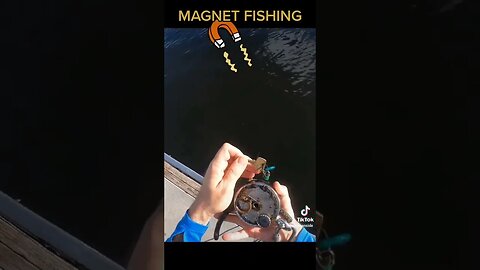 Magnet fishing under a boat dock