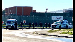 Police keep watch and fired teargas outside the Killarney entrance