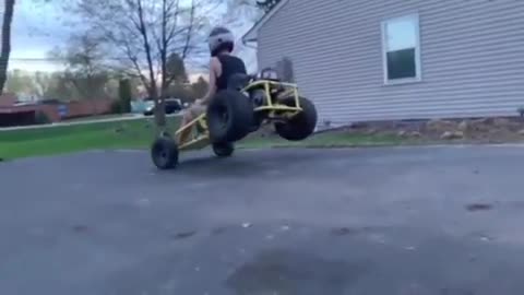 Dude crashes go-kart into friend's brand new car