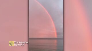 Bold rainbow keeps the pink from escaping the sky