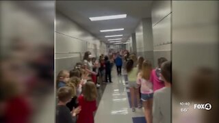 Students line halls to celebrate lunch lady's new citizenship