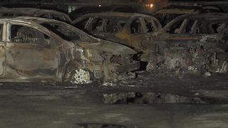 26 cars catch fire after power lines fall