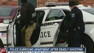 Police Surround Apartment After Deadly Shooting