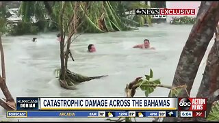 Current sweeps Bahamas residents down flooded street in aftermath of Hurricane Dorian