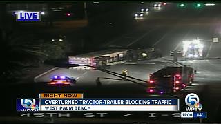 Ovrturned tractor-trailer blocking traffic