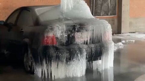 Man Parks In Worst Possible Place - Burst Pipe Freezes on Top of Car