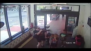 Surveillance video shows man attack woman in front of her 3 children