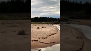 Stream running through beach