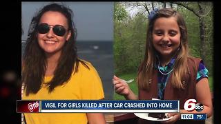 Vigil for girls killed after car crashed into home