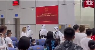 China - Alleged armed health experts at airport