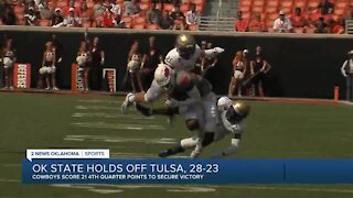 Oklahoma St holds off rival Tulsa 28-23 in Sanders’ return