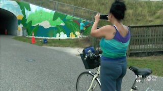 Local artists covering up graffiti with beautiful murals along Pinellas Trail