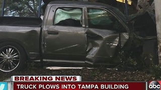 Truck plows into Tampa building