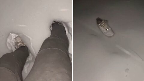 Dude loses shoe in snow, helplessly watches it slide away