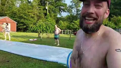 Two Men Collide On DIY Slip and Slide