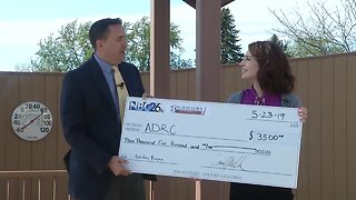 3 Degree Guarantee presents check to ADRC