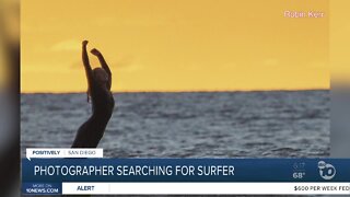 Photographer searching for female surfer in photo