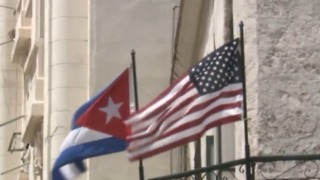 US urges no travel to Cuba, cuts embassy staff