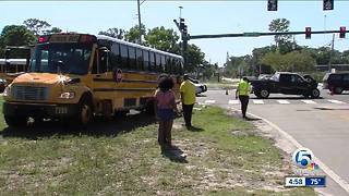 Truck and school bus collide in suburban West Palm Beach