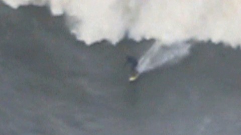 Daredevil Surfer Rides Giant Wave In Portugal