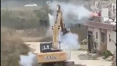 China Man Appears to Fights Off an Excavator Sent to Demolish His Building with Firework