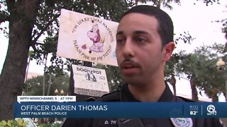 West Palm Beach police officer takes a knee during protest against police brutality