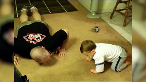 Baby Tries to Mimic Dad's Push-ups