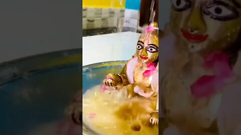 Lord Krishna is taking a bath