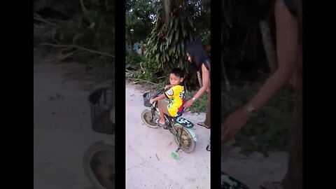 Teaching a Kid on How to Ride Bicycle