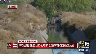 Woman hurt in crash into canal