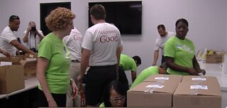 Volunteers pack hurricane food kits for seniors