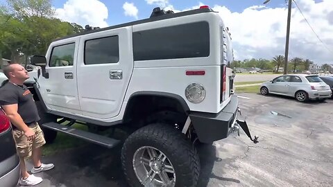 H2 Lifted Hummer and Japanese Van With A Snorkle
