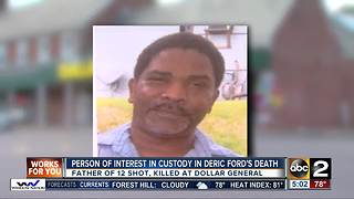 Person of interest in custody in murder at Dollar General store