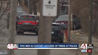 Two men in custody, accused of firing at officers