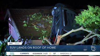 SUV lands on roof of home