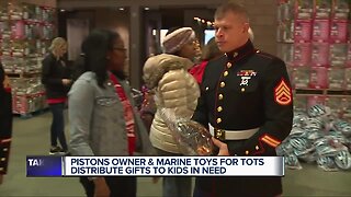 Pistons Owner and Marine Toys for Tots distribute gifts to kids in need