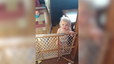 "A Baby Girl Argues with Her Mother About Climbing Over A Baby Gate"