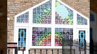 Assisted Living residents decorate windows