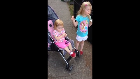 Toddler can't resist dancing to marching band