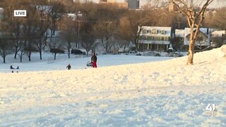 Some people take to the hills for sledding during Thursday's snow day