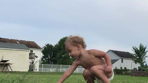 Baby falls for sprinkler trick over and over again