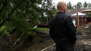 Homeowner's truck removed from landslide in his backyard