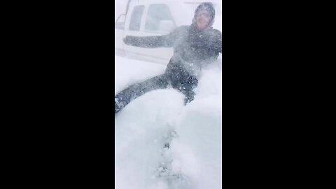 Watch this guy demonstrate how intense the Newfoundland blizzard is