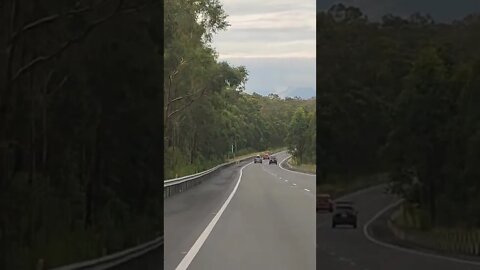 Cruisin' on the Pacific Coast Motorway, cloudy mountains in the background 🇦🇺