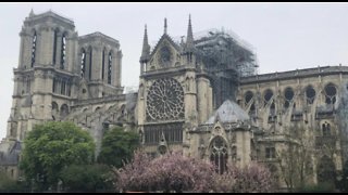 French president promises to rebuild Notre Dame