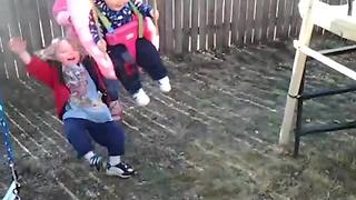 Little Girl Gets Knocked Over By A Swing