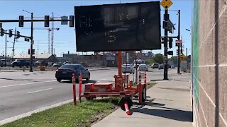 Hacked construction sign catches the eyes of morning commuters in Denver's RiNO neighborhood