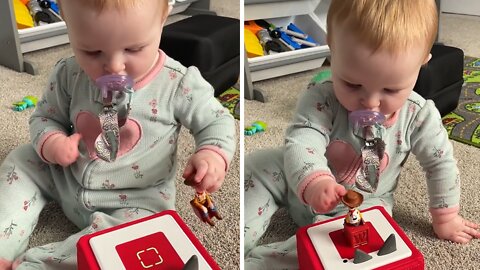 Determined baby overcomes disability to play with toy