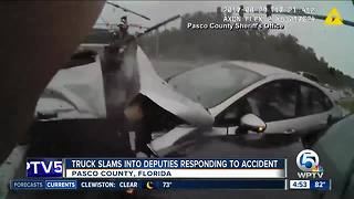 Truck slams into Florida deputies responding to crash